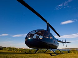 Robinson R-44 ready for takeoff in late afternoon